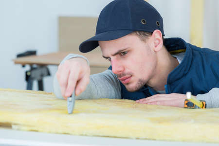 serviceman at work with cutterの写真素材