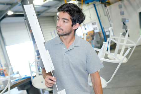 Man inspecting suspended object