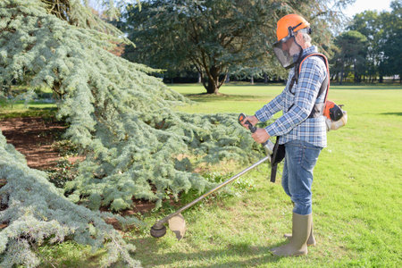worker using a portable mower