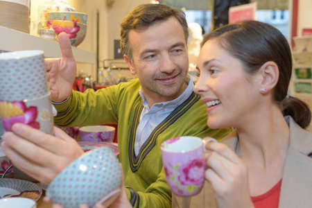 smiling lovely couple shopping at the supermarketの写真素材