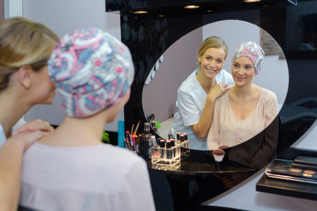 Beautician admiring woman's appearanceの写真素材