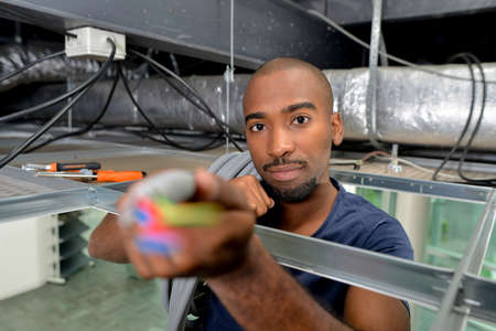 Electrician checking the ceilingの写真素材