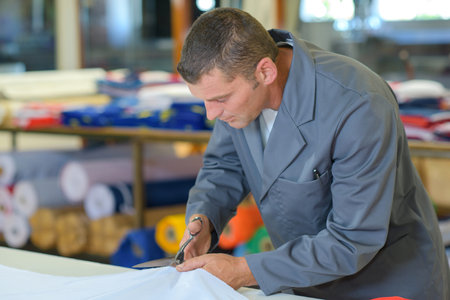 Man cutting material
