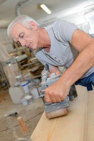 Carpenter in the workshopの写真素材