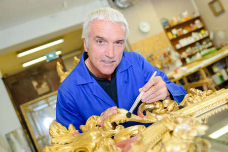 craft artist in his workshopの写真素材