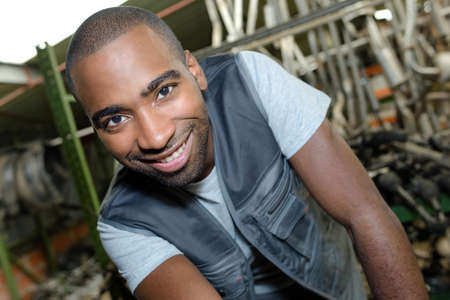 posing in a car junkyardの写真素材