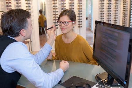 optomoetrist measuring pretty client eyeseightの写真素材