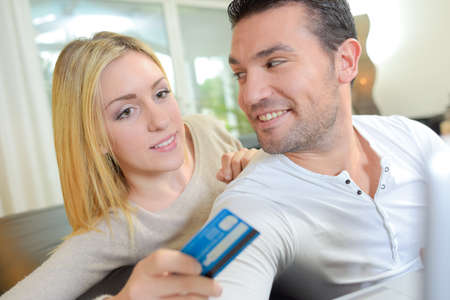 Couple with credit cardの写真素材