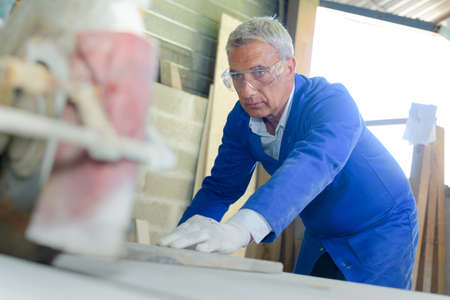 Senior manual worker at workの写真素材