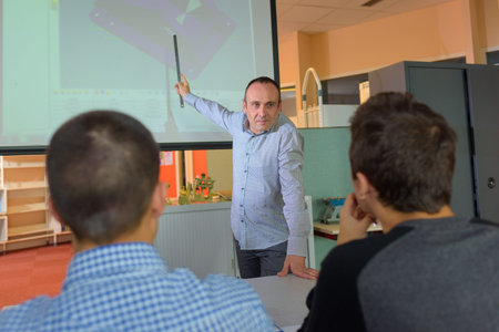 science teacher giving lesson using projector
