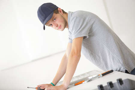 Portrait of tradesman in kitchenの写真素材