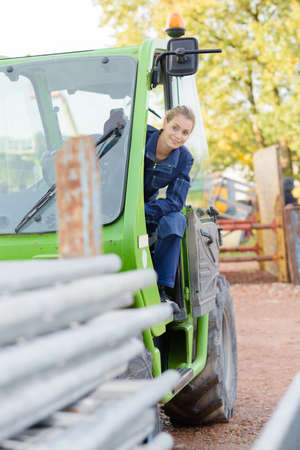 Woman operating telehandlerの写真素材