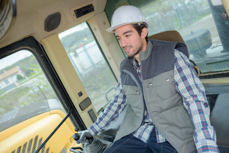 man operating a heavy equipmentの写真素材