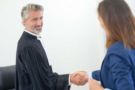 judge shaking handsの写真素材