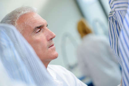 man choosing shirtの写真素材