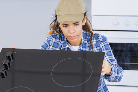 inspecting the hob connectionの写真素材