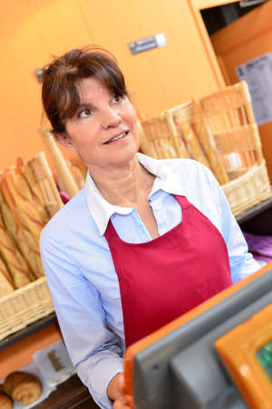 Woman working in a bakeryの写真素材