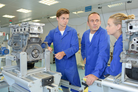 Engineering apprentices with instructor