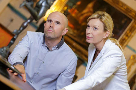 looking at classical artの写真素材