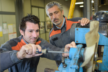 Mechanics working on agricultural machine