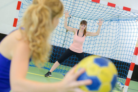 womans handball shooting practice
