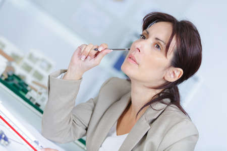 young businesswoman sitting at workplaceの写真素材