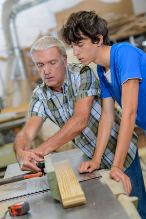Using a table sawの写真素材