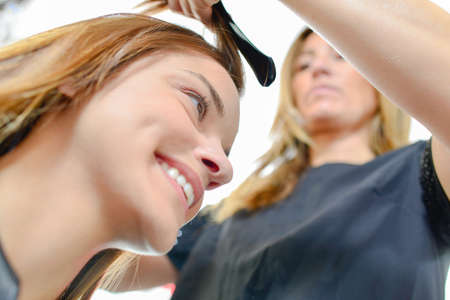 girl having a service in a parlorの写真素材