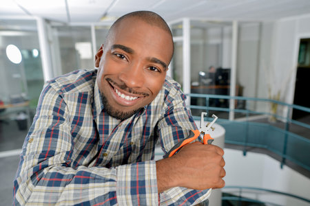Electrician holding some pliers