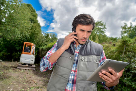 landscaping artist on telephoneの写真素材