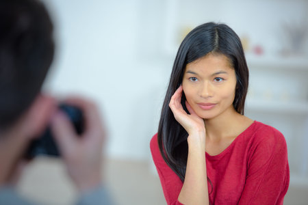 Man taking a photo of his girlfriend