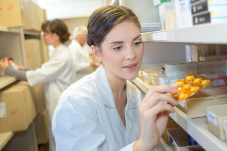 Pharmacist selecting medicationの写真素材