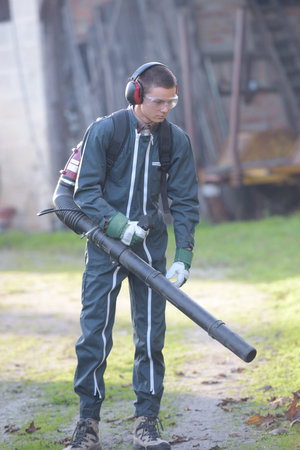 blowing the dry leaves