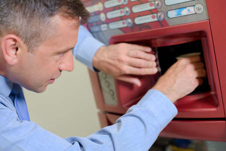 taking out a drinkの写真素材