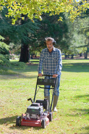 Man mowing grassの写真素材