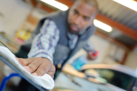 mechanic polishing carsの写真素材