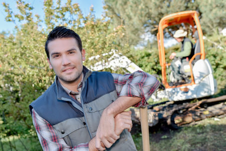 Builders working in a gardenの写真素材