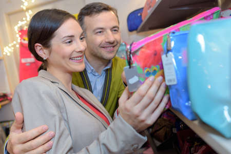 young people shopping in supermarketの写真素材