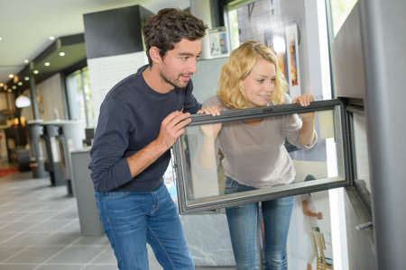 Couple choosing a woodburnerの写真素材