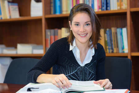 woman reading in the libraryの写真素材