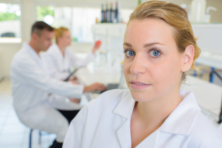 Portrait of woman in white coatの写真素材