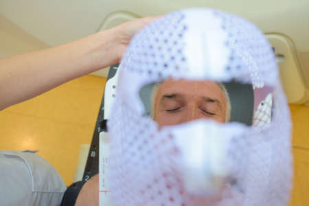 putting on shield before scanの写真素材