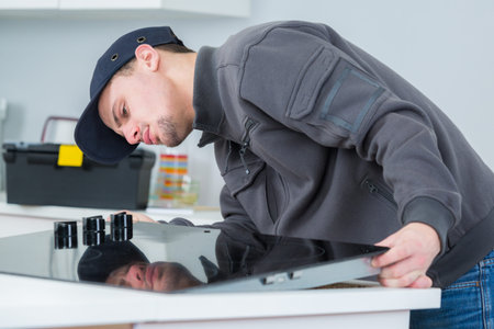 Workman fitting ceramic hobの写真素材