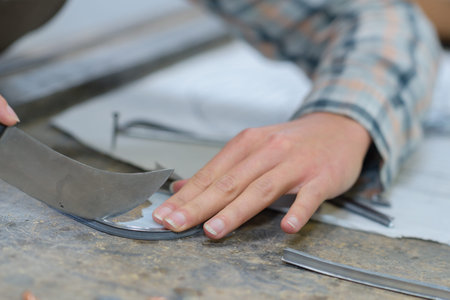 man carving with knife