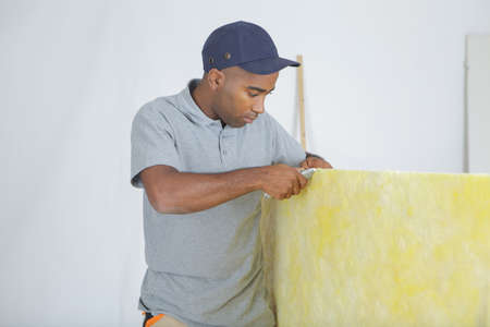 Workman cutting insulationの写真素材
