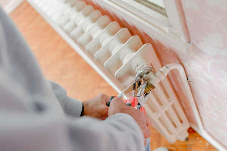 Fixing a radiatorの写真素材