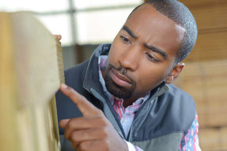 man operating machineの写真素材