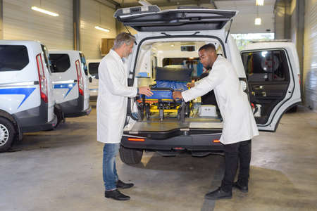 Paramedics preparing ambulanceの写真素材