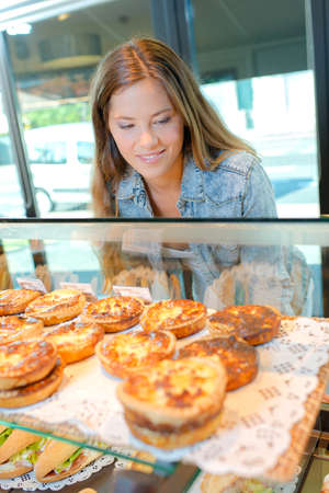 girl choosing snackの写真素材