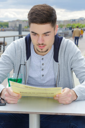 man waiting order in bar terrace